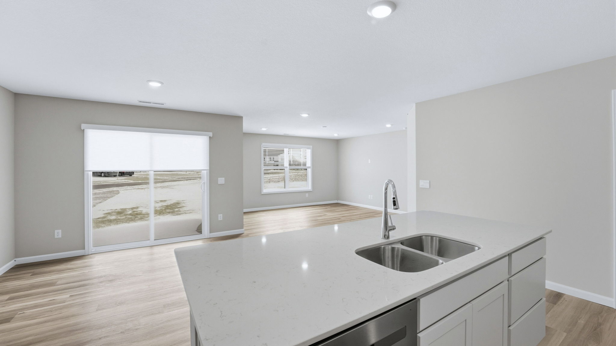 casual dining space with lvp flooring and sliding door to backyard and covered patio