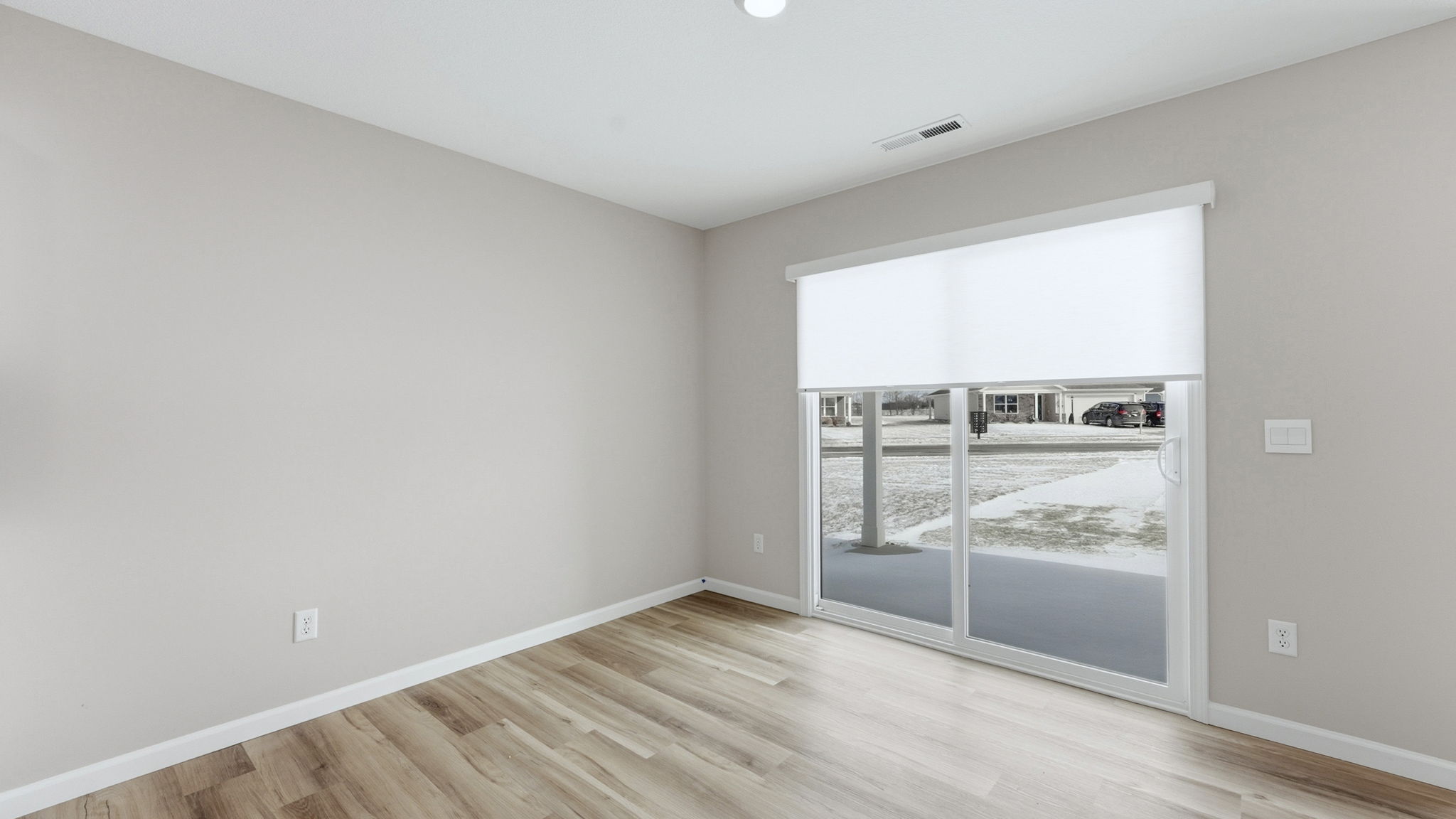 casual dining space with lvp flooring and sliding door to backyard and covered patio