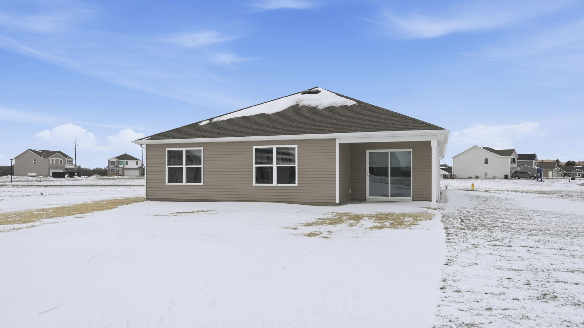 exterior with large backyard and covered patio