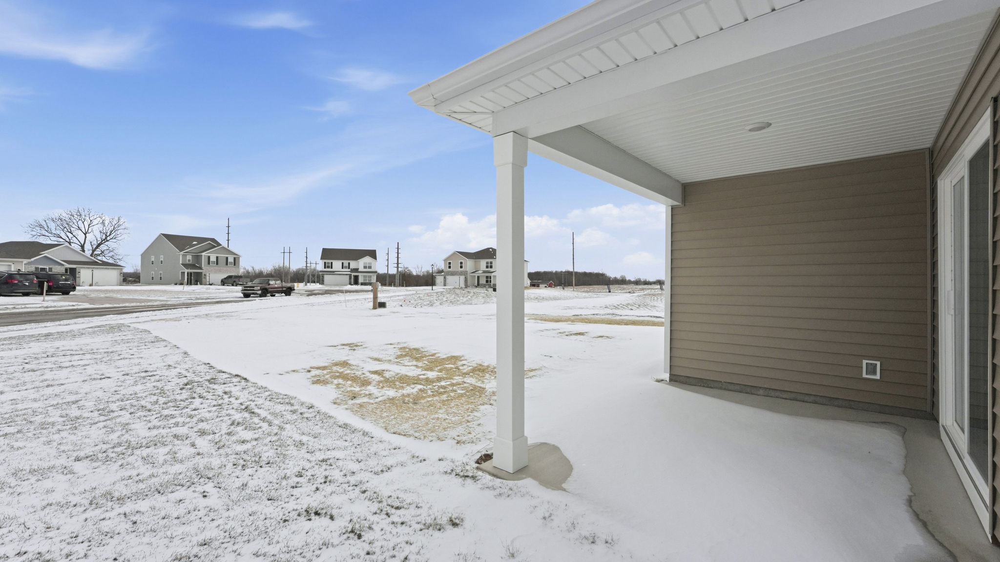 exterior with large backyard and covered patio