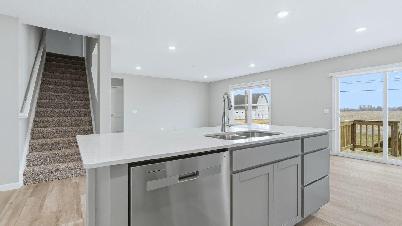 staircase leading to second floor with carpet finish