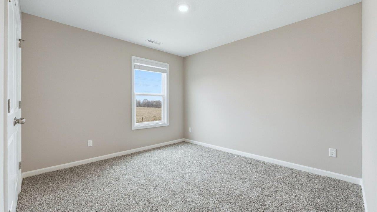 bedroom 4 with beige carpet and popular grey walls