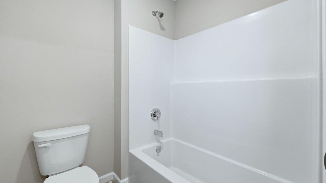 full bathroom with private water room and tub shower