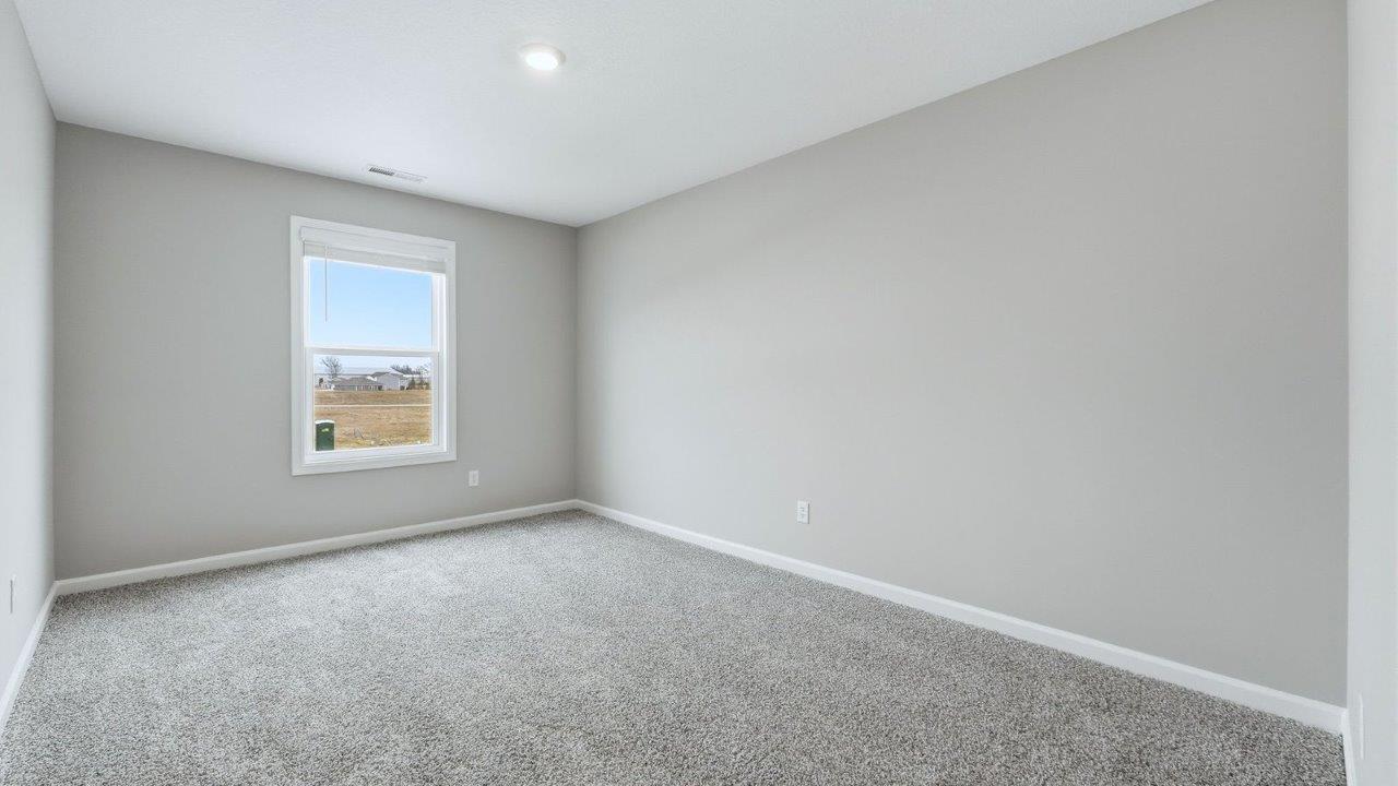 bedroom 2 with carpet flooring, closet, and 1 window