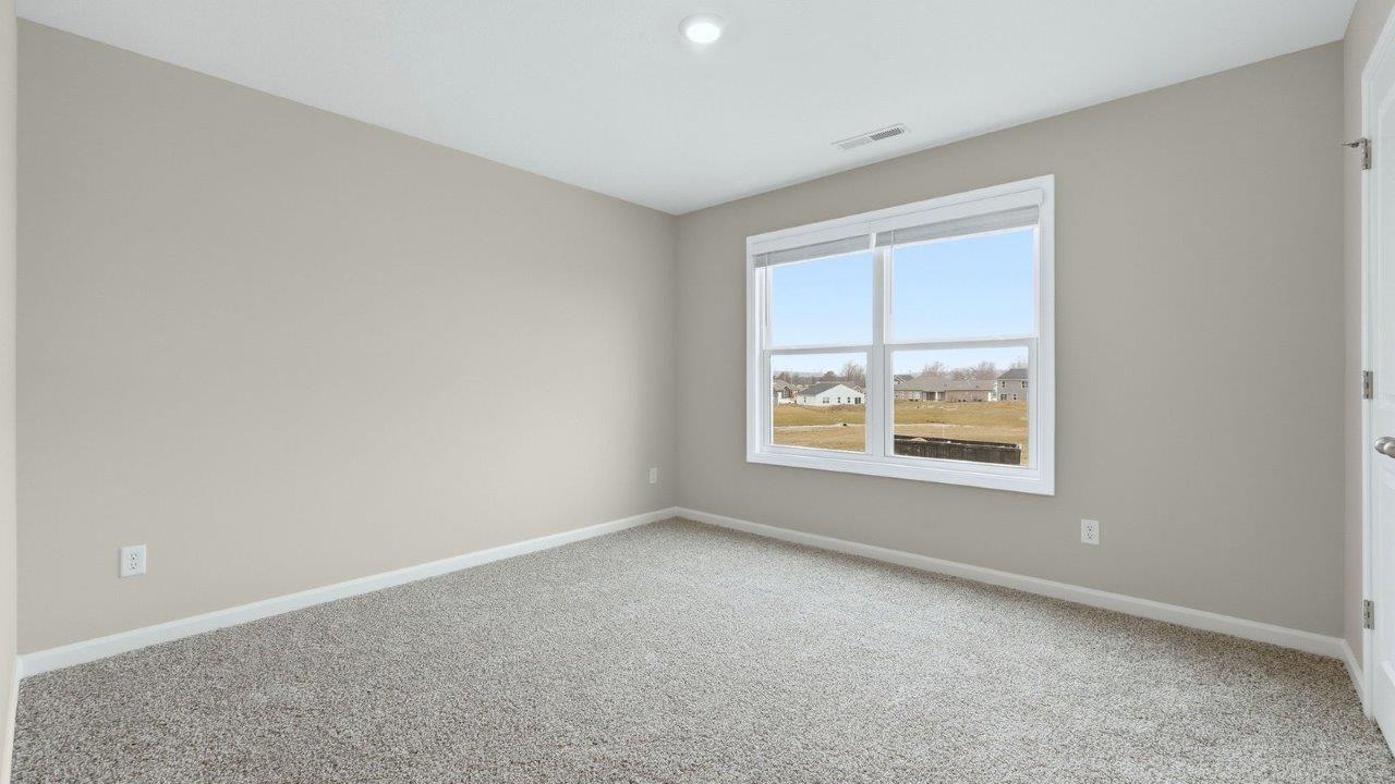 bedroom 3 with carpet, 2 windows, and closet