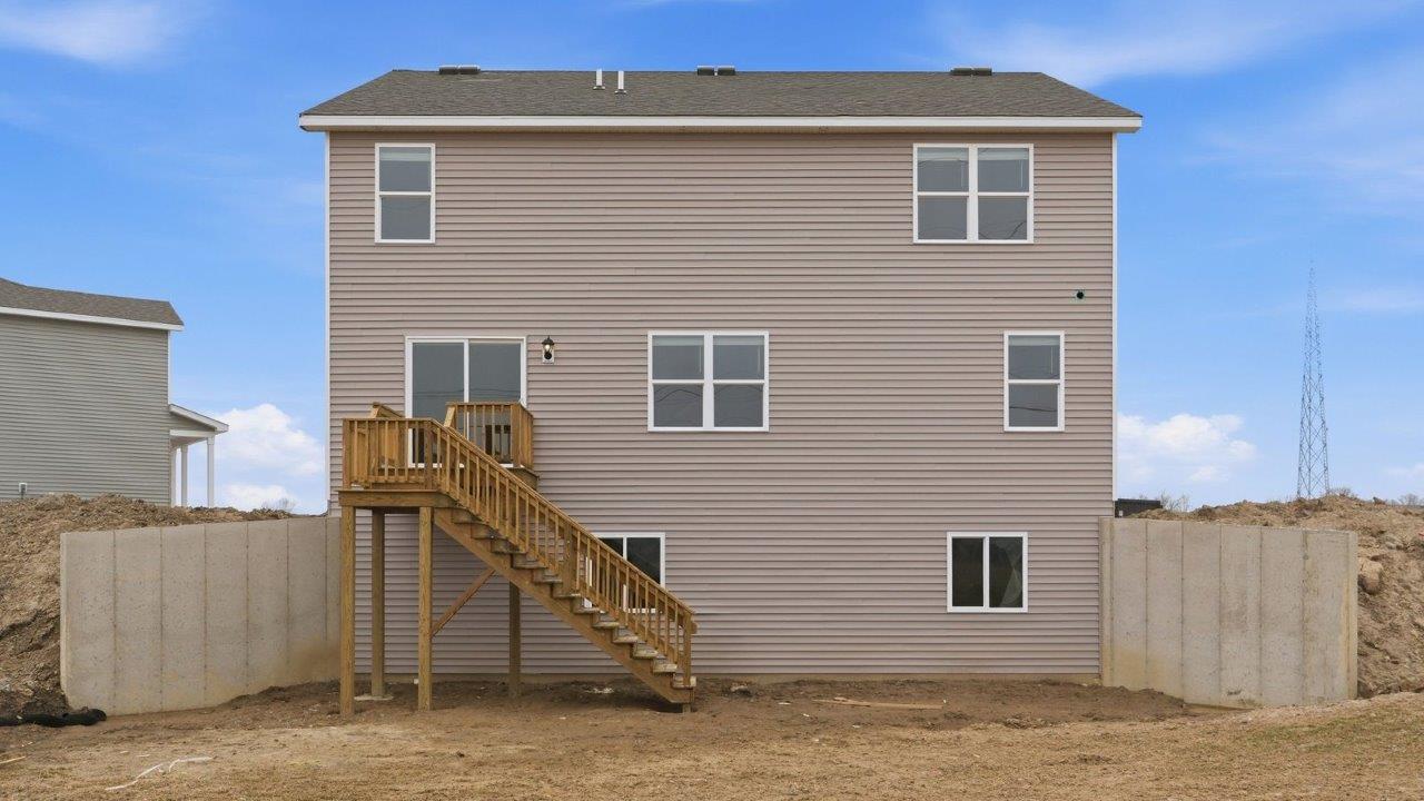 henley backyard with deck, retaining walls, and spacious yard