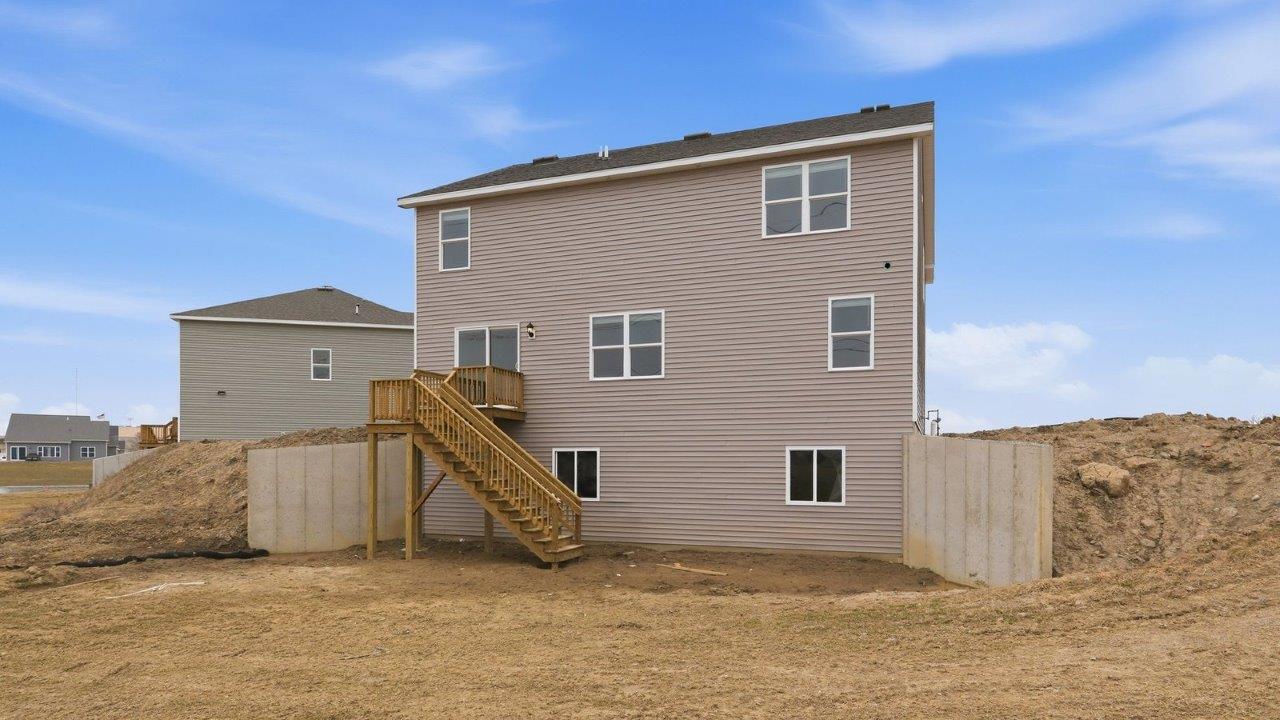 henley backyard with deck, retaining walls, and spacious yard