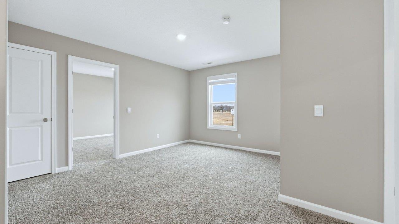 second floor loft with carpet flooring