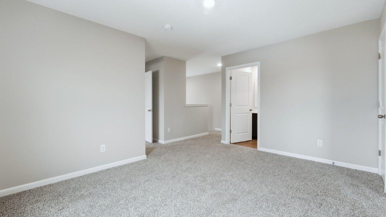 second floor loft with carpet flooring