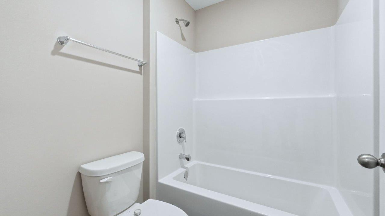 full bathroom with dual sink, lvp, tub shower, and private water room