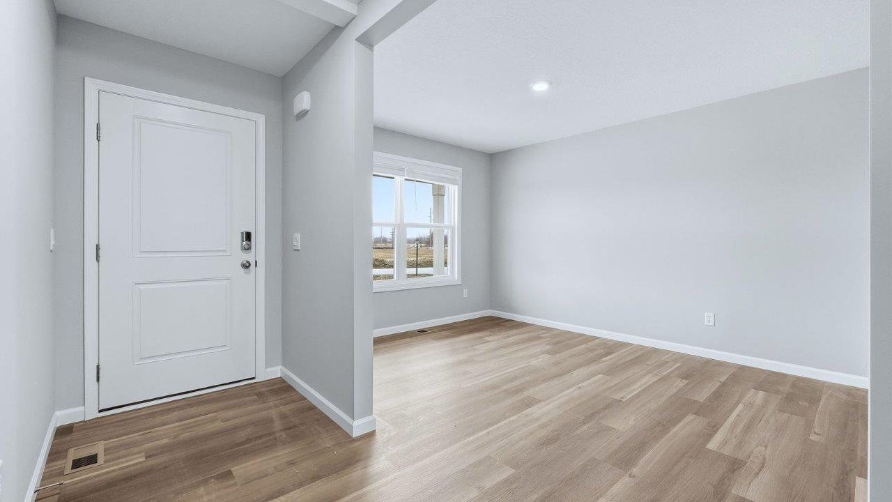front door and foyer with mohawk eastmont lvp leading to study and main living area