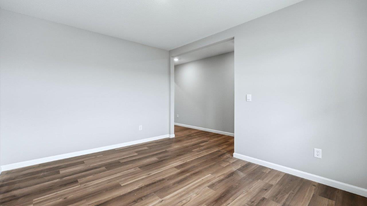 front of home study with mohawk eastmont lvp, 2 windows, and popular grey walls