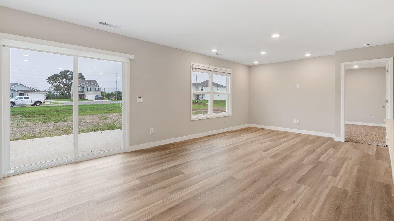 fawn creek estates freeport - causal dining room with lvp flooring and sliding glass door to backyard