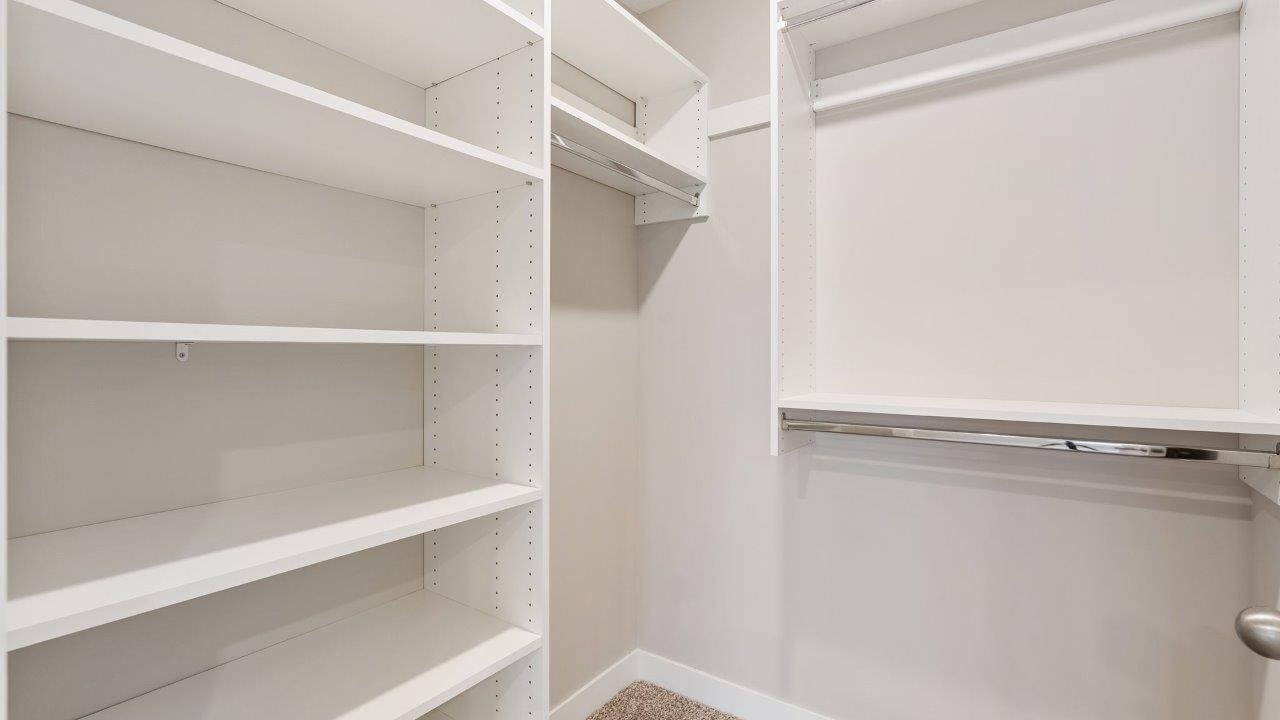 fawn creek estates freeport - primary ensuite walk in closet with built in shelving
