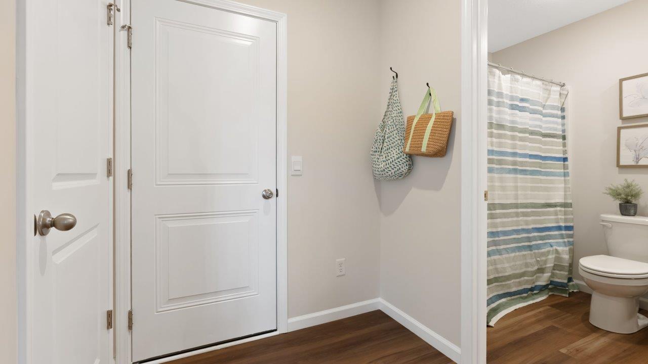 farmstead at carroll creek henley model home garage door and first floor full bathroom