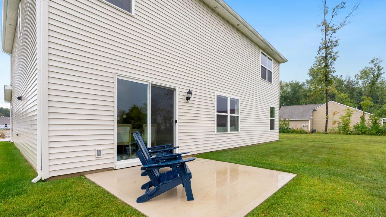 farmstead at carroll creek henley model home rear exterior patio and backyard