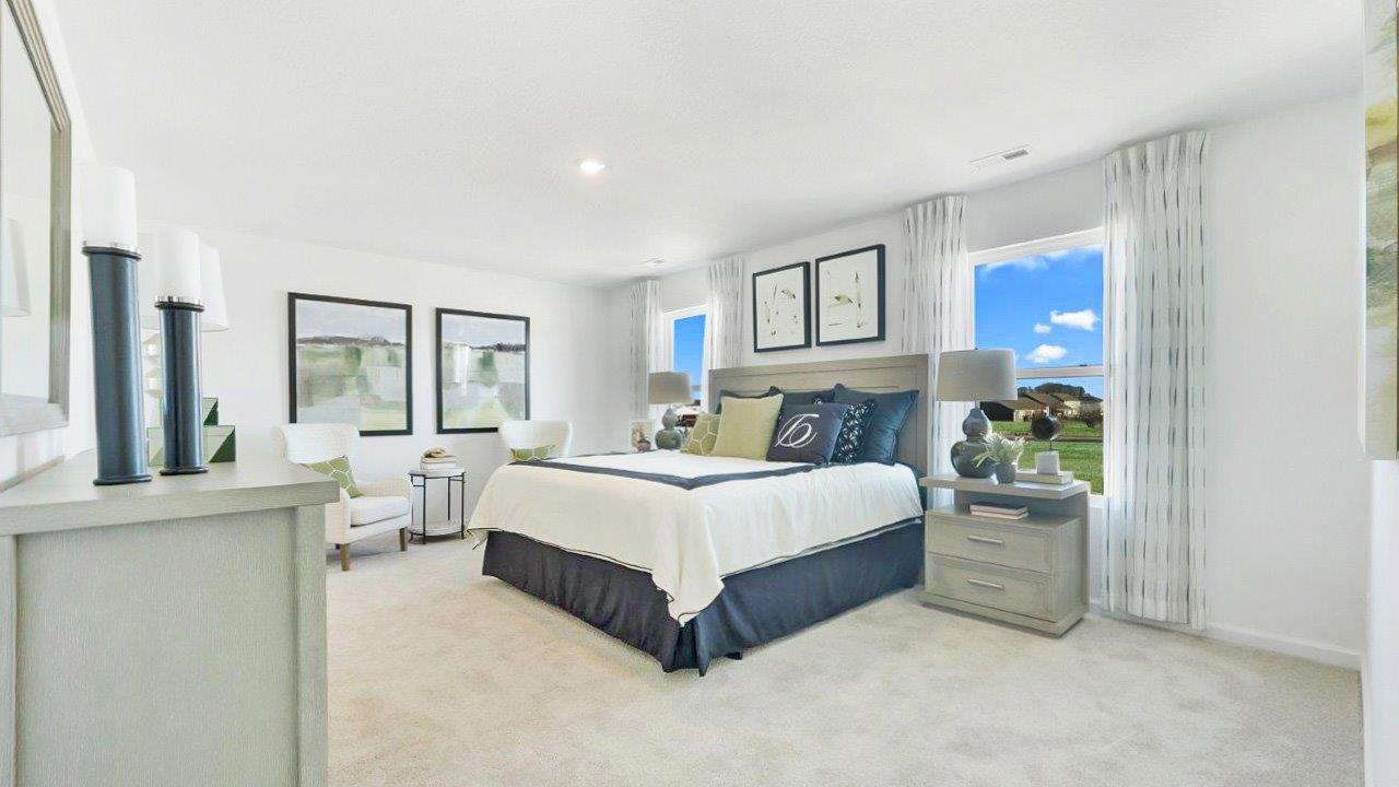 bellamy primary bedroom with carpet, 2 windows, and ensuite bath and walk in closet