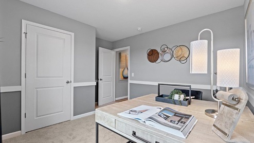 sonora chatham model home Bedroom 2 with carpet flooring decorated as office space