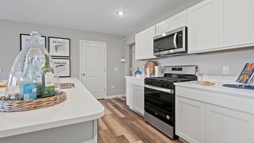 Sonora Chatham Model home kitchen with white cabinetry