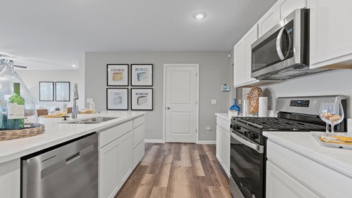 Sonora Chatham Model home kitchen with cararra miami quartz countertops