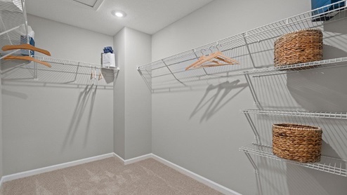 sonora chatham model home Closet off of main bedroom with wire shelving