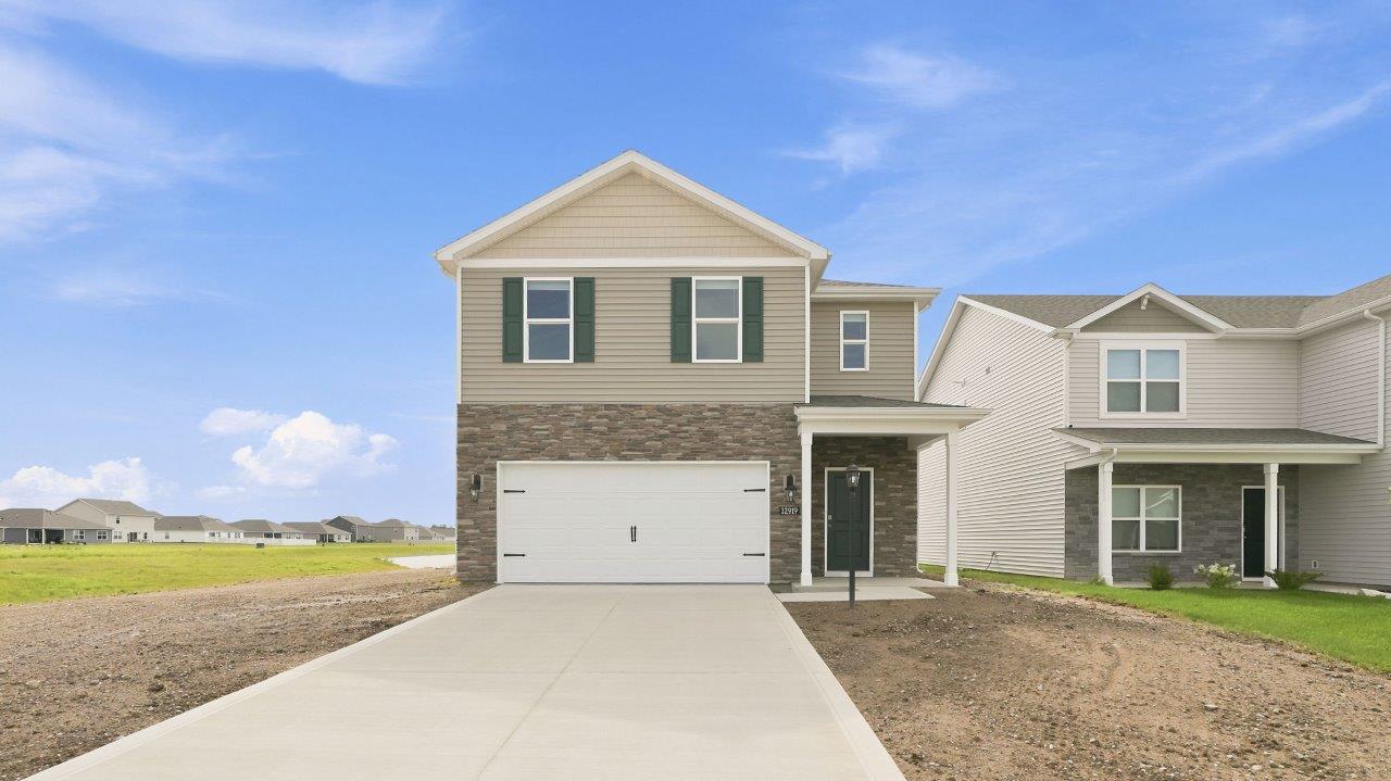 sonora elm exterior with 2 car garage and covered front door patio