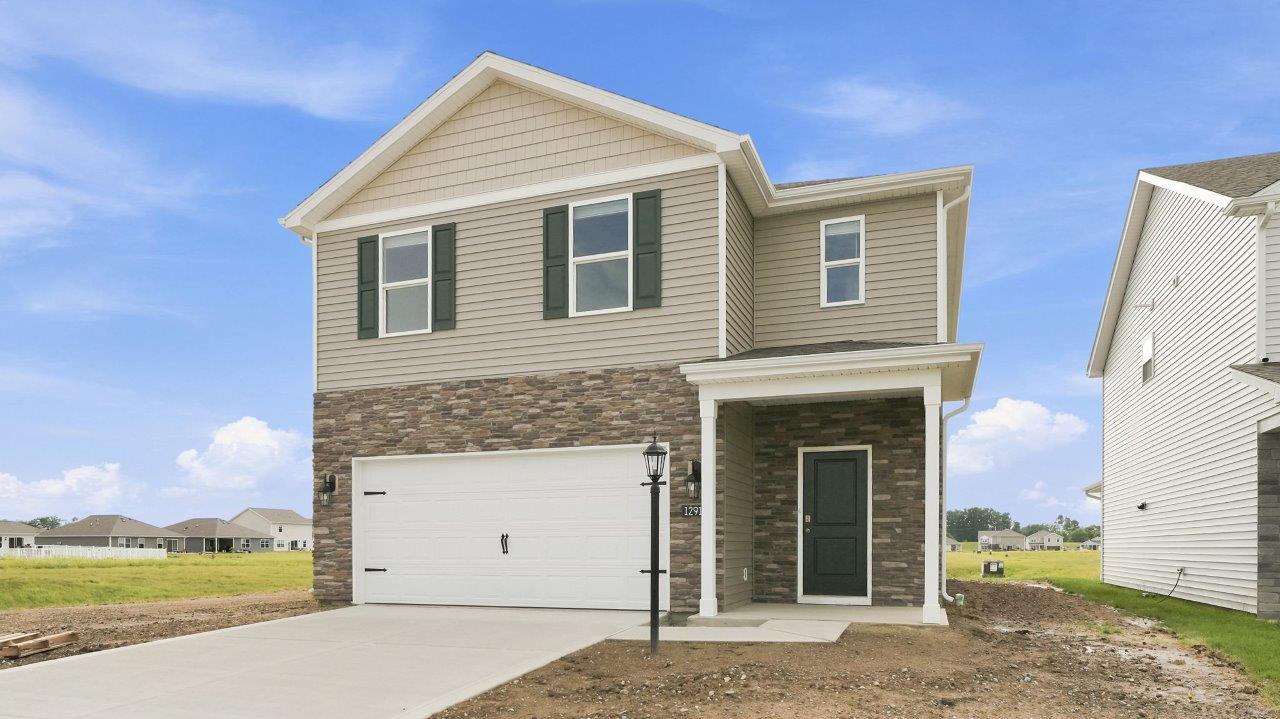 sonora elm exterior with 2 car garage and covered front door patio
