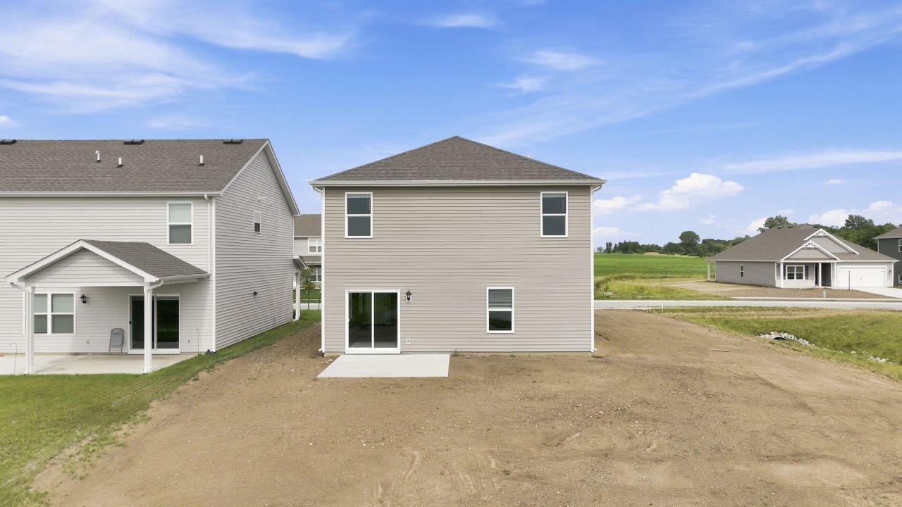 sonora elm backyard with concrete patio with pond view