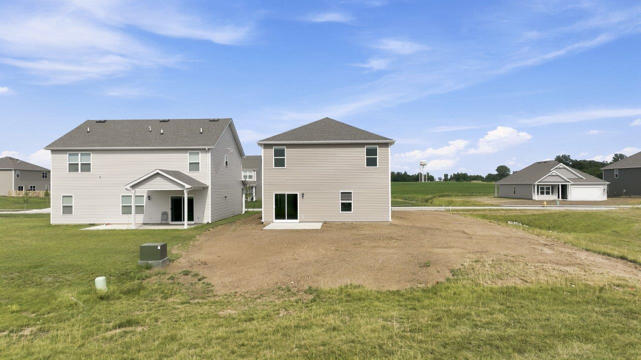 sonora elm backyard with concrete patio with pond view