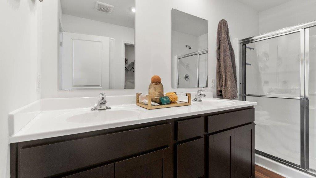 bellamy primary bath with walk in shower and dual sinks