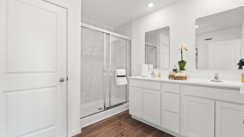 Chatham model bathroom with walk in shower and LVP flooring