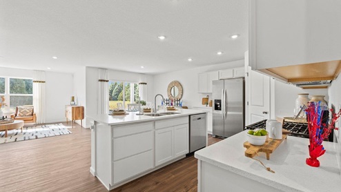 Chatham model home with open floor plan kitchen, dining room, and living room