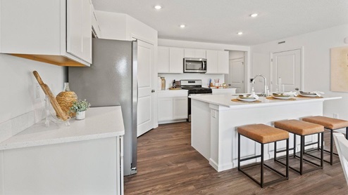 Chatham model home kitchen with 30" upper cabinetry.