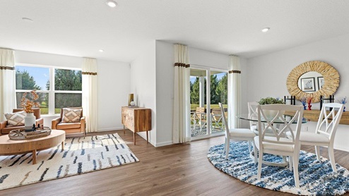 Chatham model home dining room and living room with LVP flooring