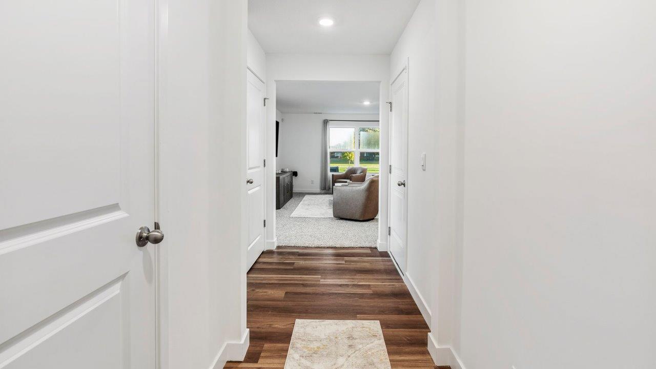 Greenbrier Pine Model Home - foyer with mohawk eastmont lvp flooring leading into open layout living room and kitchen