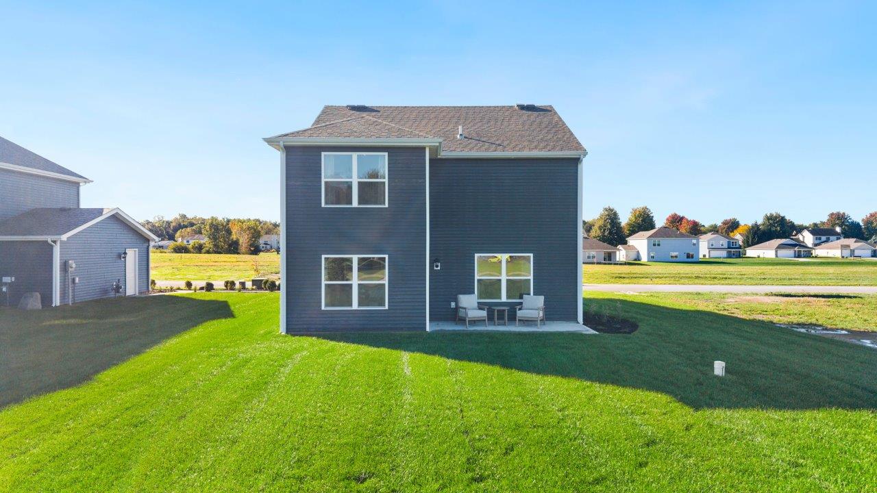 Greenbrier Pine Model Home - rear exterior with concrete patio