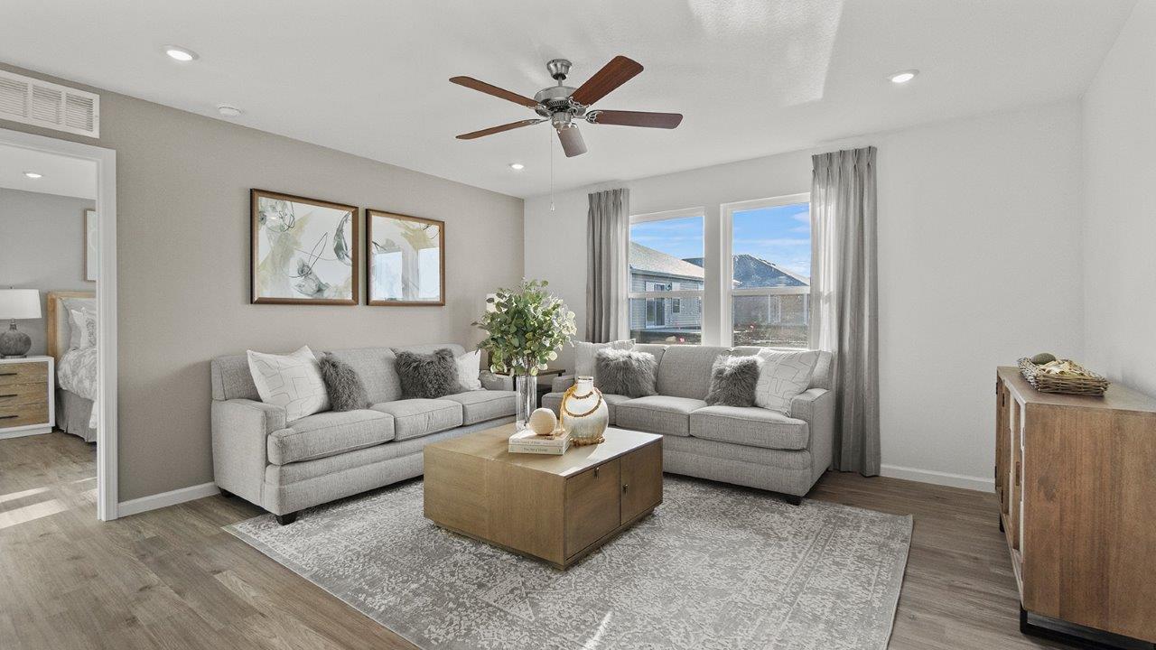 chatham living room open concept with 2 windows, fan, lvp flooring