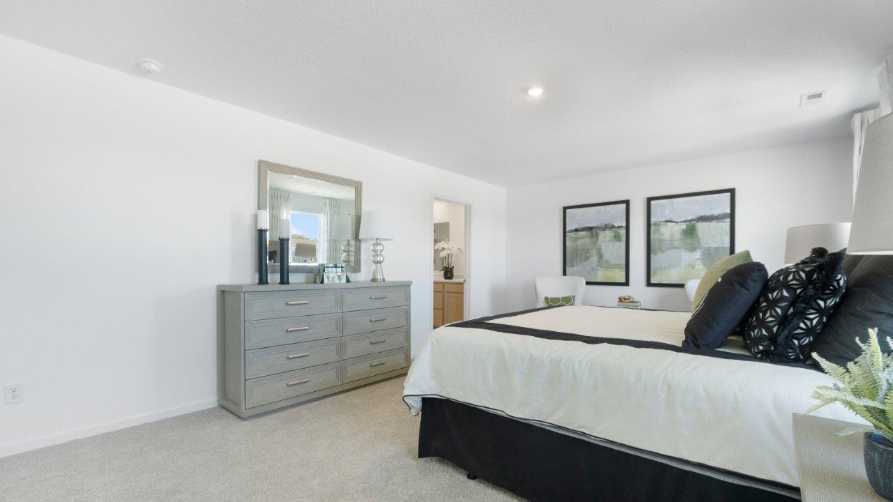 bellamy spacious primary bedroom with ensuite bath and closet