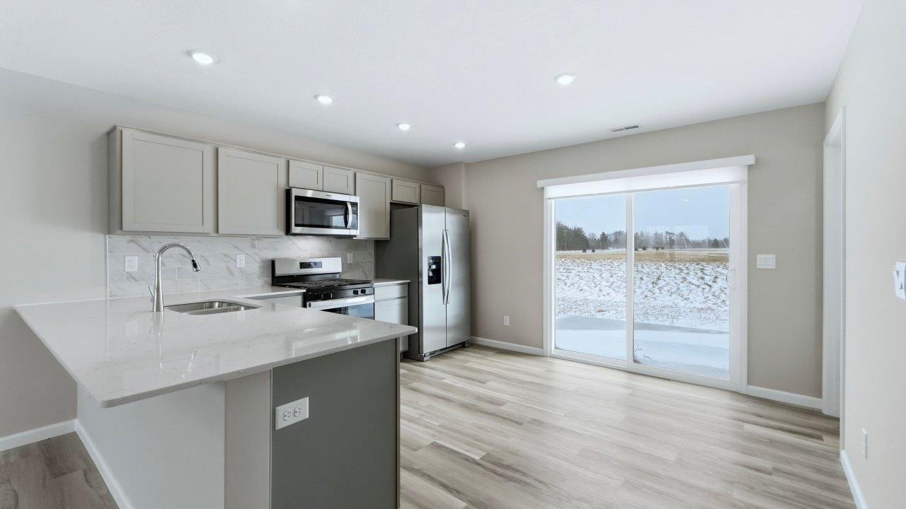 kitchen with sliding door to backyard patio