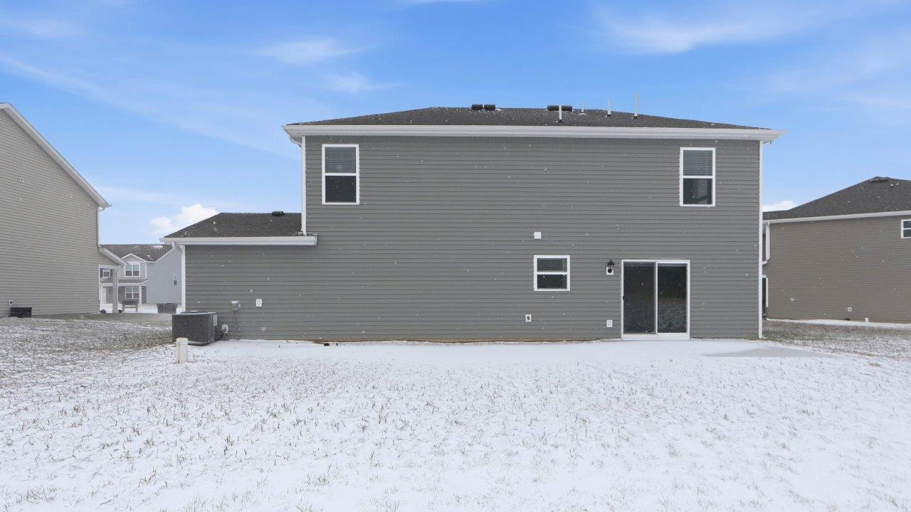 home rear exterior with concrete patio