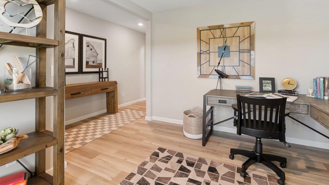 Greenbrier Stamford Model Home - study with mohawk avery lvp flooring, popular grey walls, and furnished as office