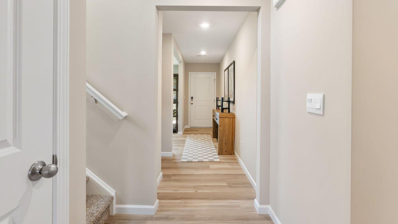 Greenbrier Stamford Model Home - foyer with mohawk avery lvp flooring and popular grey walls