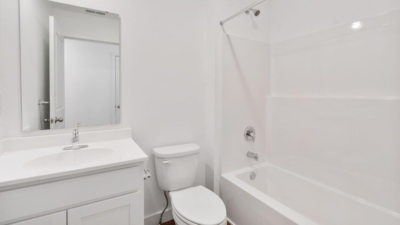 greenbrier cabral full bathroom with single sink vanity and tub shower