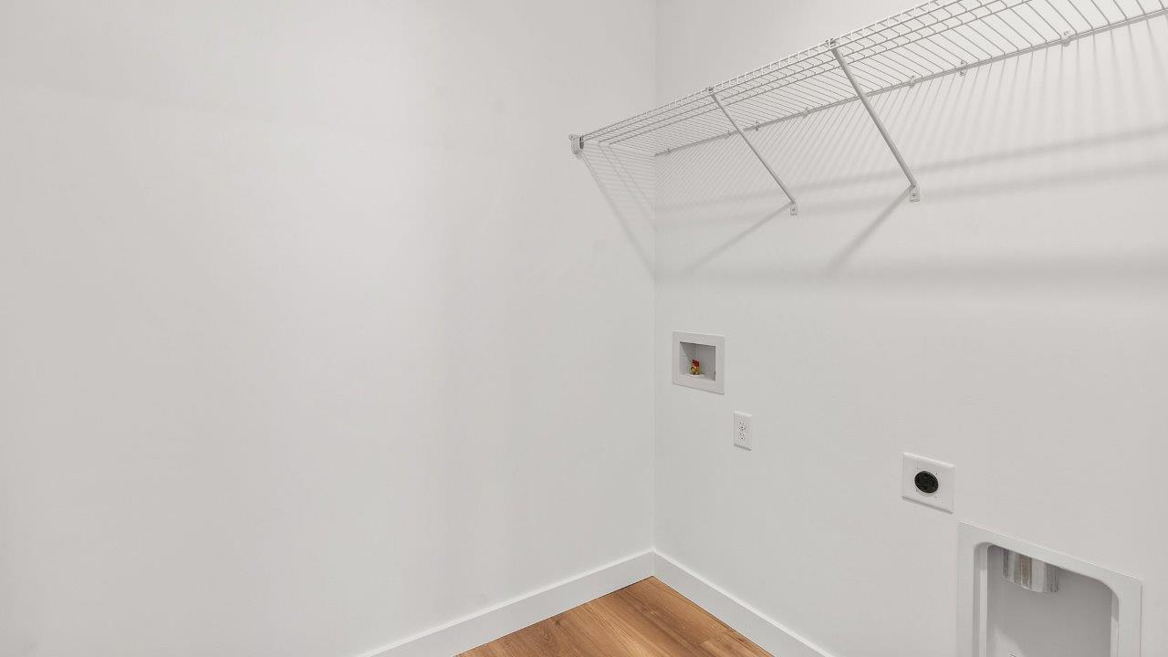 greenbrier cabral laundry room with ventilated shelving and lvp flooring