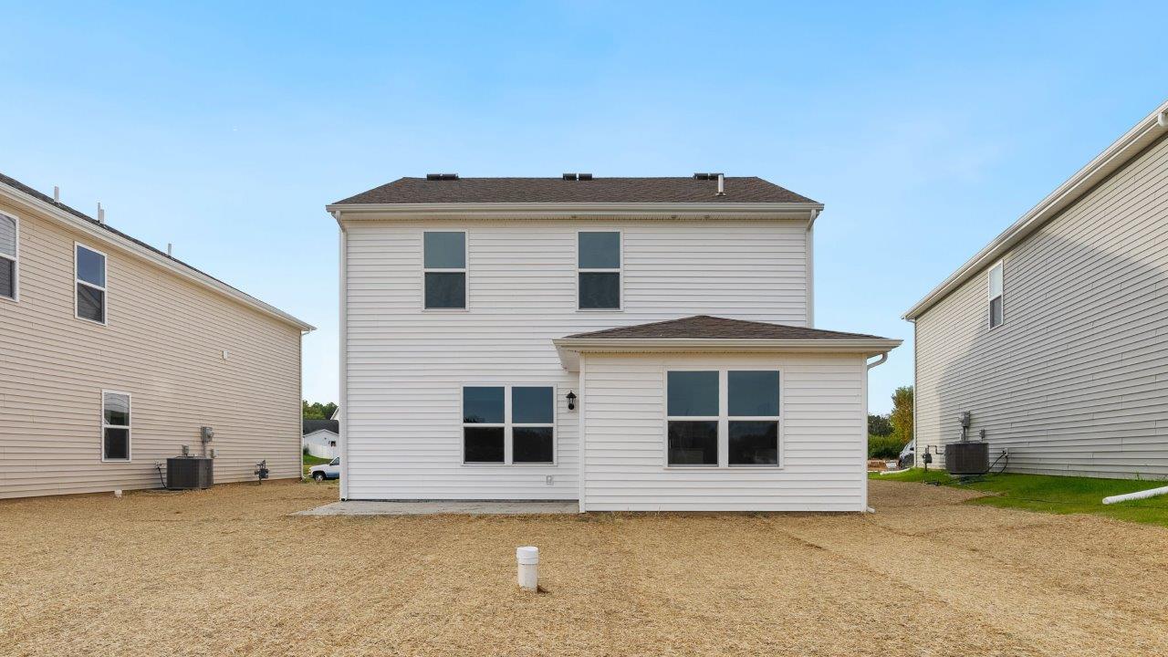 greenbrier cabral rear exterior with concrete patio and spacious yard
