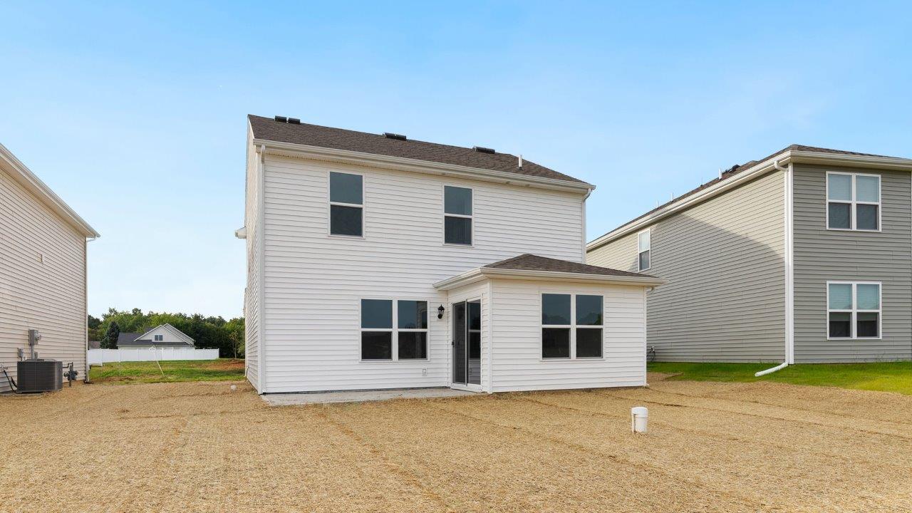 greenbrier cabral rear exterior with concrete patio and spacious yard