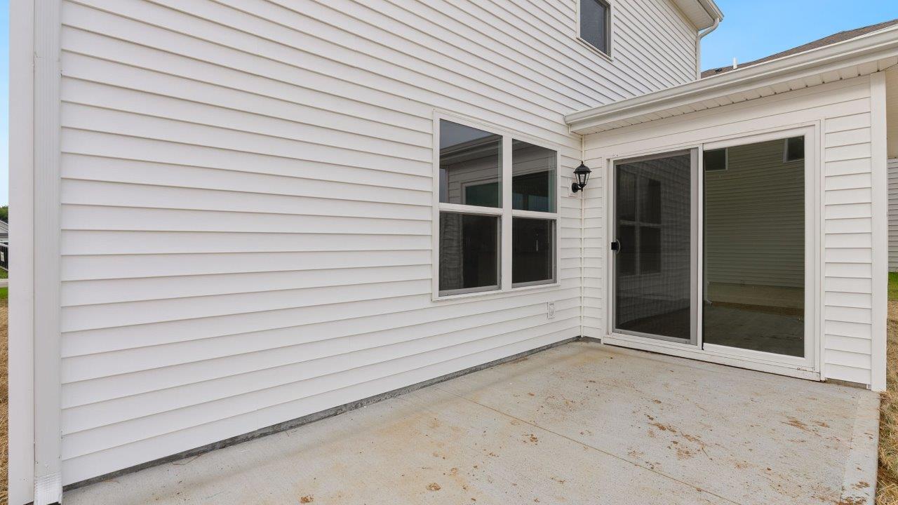 greenbrier cabral rear exterior with concrete patio and spacious yard