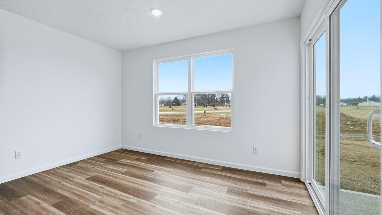 dining room with lvp and sliding door to backyard patio