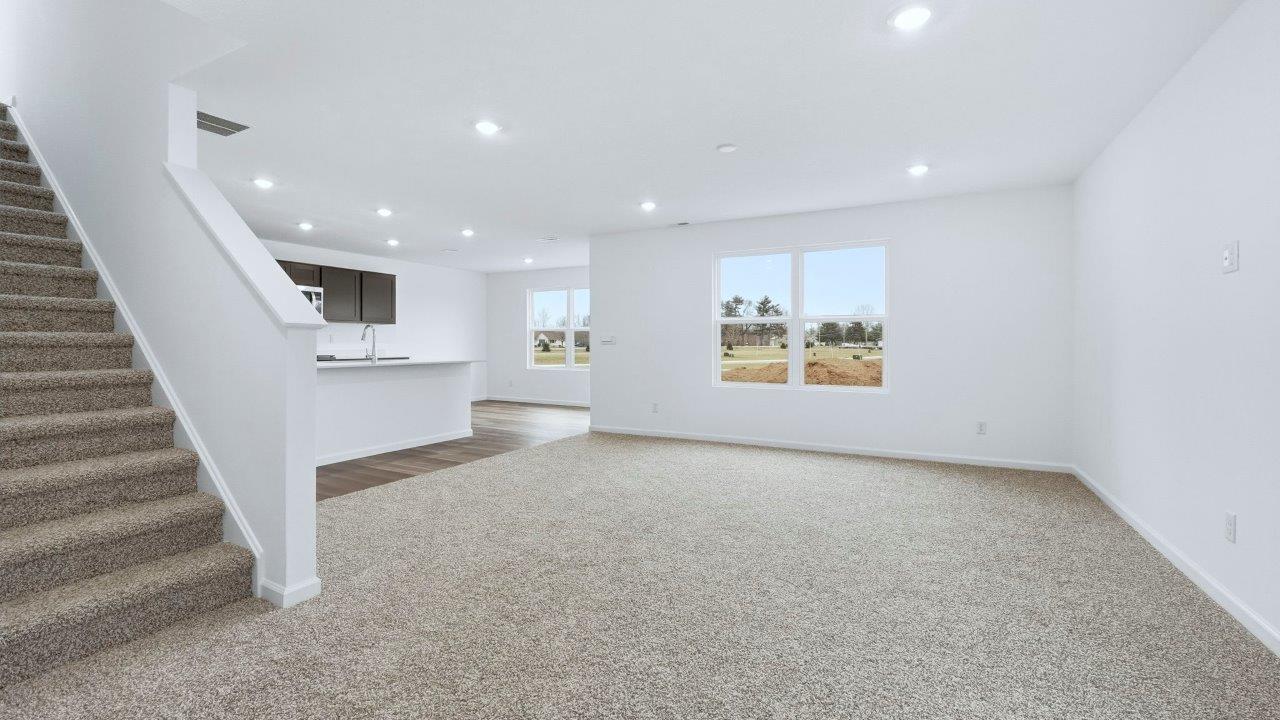 open plan living room, dining room, and kitchen