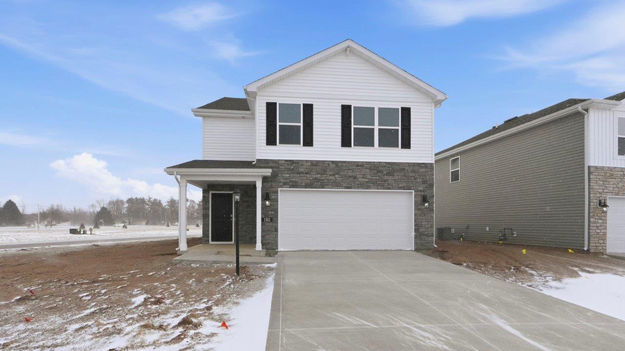 Greenbrier Elder exterior with 2 car garage and covered patio